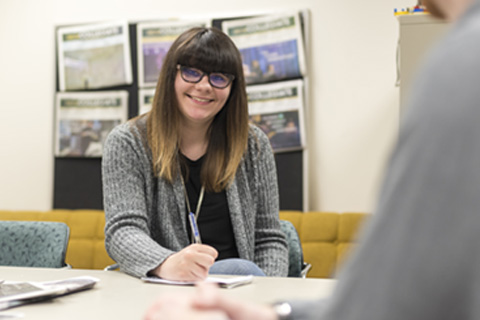 Justine working in the Collegiate office.